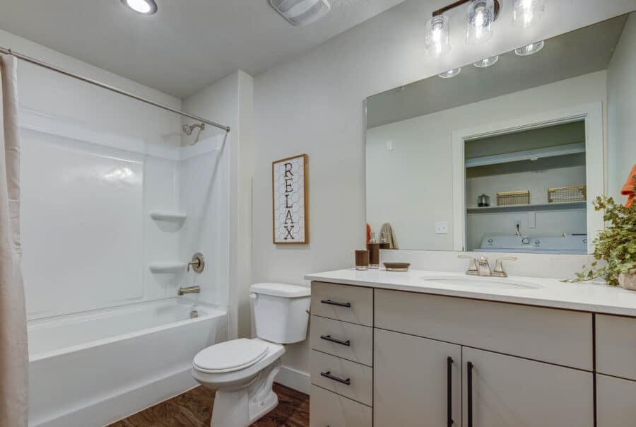 Luxury apartment bathroom with vanity and shower